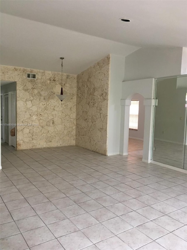 empty room featuring light tile patterned floors