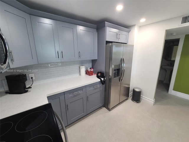 2851 NE 183rd St Unit 511E, Aventura, FL 33160 - kitchen with stainless steel refrigerator with ice dispenser, decorative backsplash, gray cabinets, and electric range oven