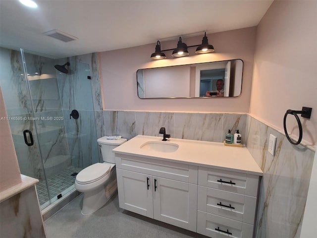 2851 NE 183rd St Unit 511E, Aventura, FL 33160 - bathroom featuring vanity, tile walls, toilet, and walk in shower