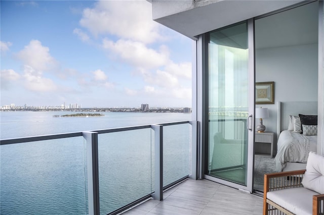 balcony featuring a water view