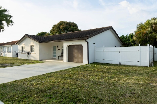 exterior space featuring a garage and a yard