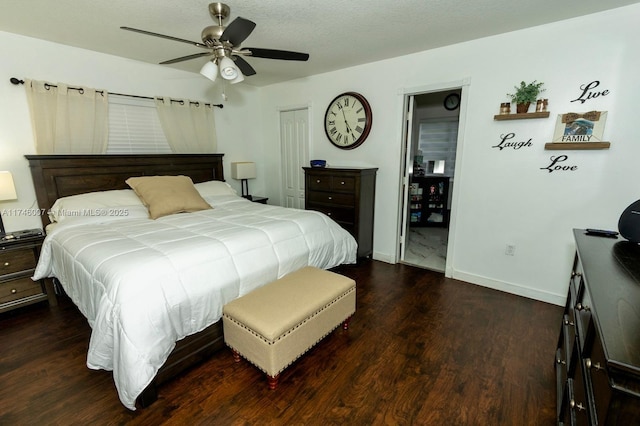 bedroom with ceiling fan, dark hardwood / wood-style floors, a closet, and a textured ceiling