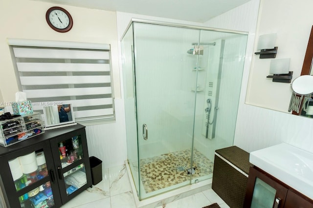 bathroom with a shower with shower door