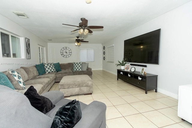 tiled living room featuring ceiling fan