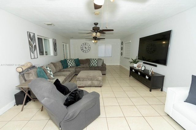 tiled living room featuring ceiling fan