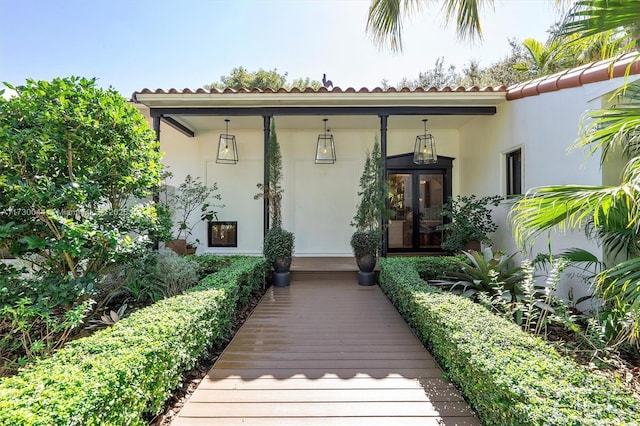 exterior space with covered porch and stucco siding