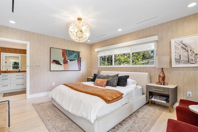 bedroom featuring light wood-style floors, recessed lighting, and wallpapered walls