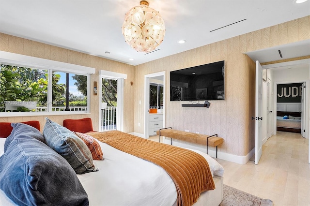 bedroom with access to exterior, recessed lighting, light wood finished floors, and wallpapered walls