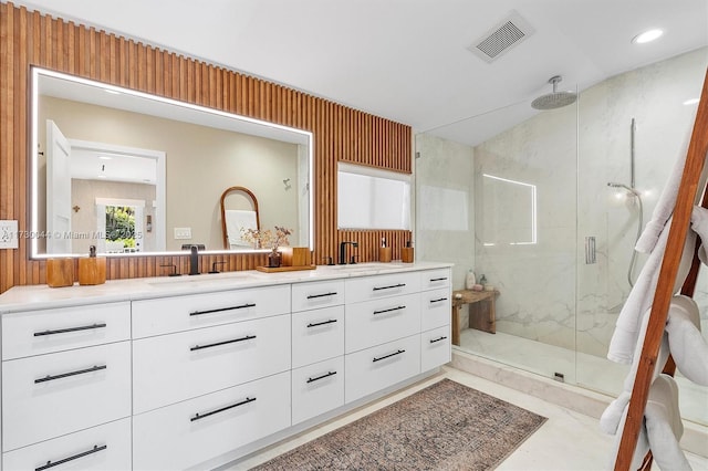 full bathroom with recessed lighting, visible vents, vanity, and a marble finish shower