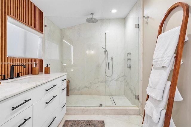 full bath with marble finish floor, recessed lighting, a marble finish shower, and vanity