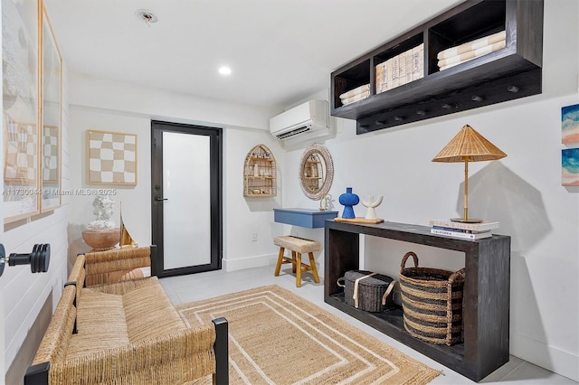 interior space with recessed lighting, a wall mounted air conditioner, and baseboards