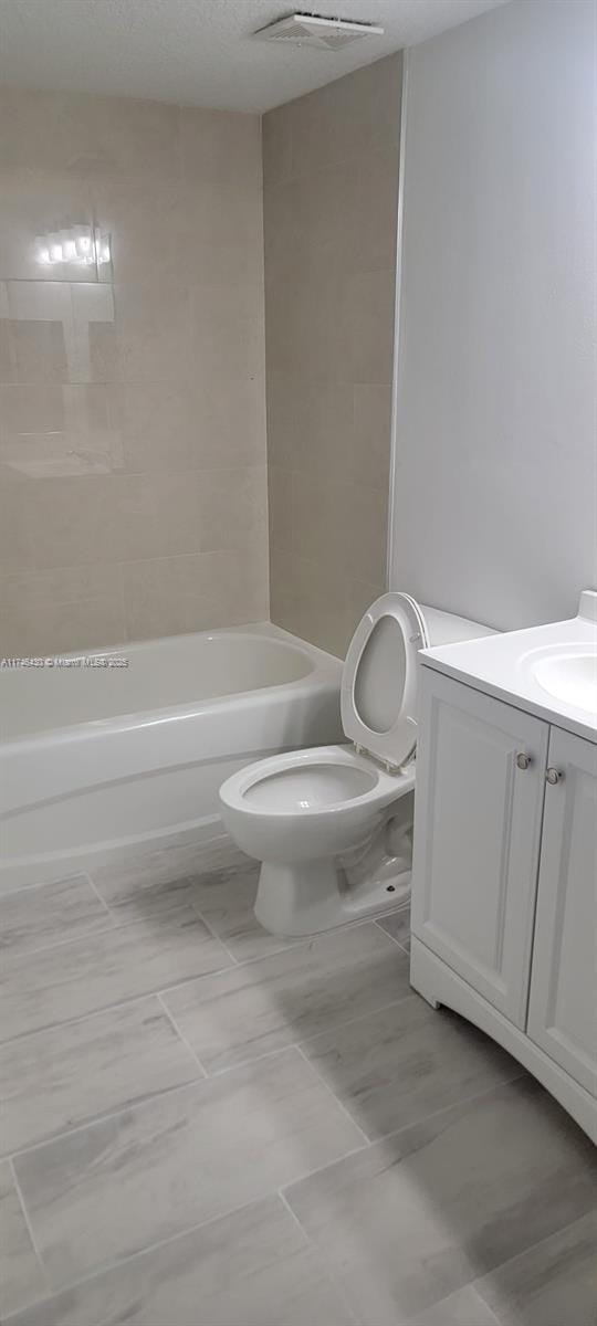 3505 Briar Bay Blvd Unit 104, West Palm Beach, FL 33411 - full bathroom with toilet, vanity, and shower / tub combination