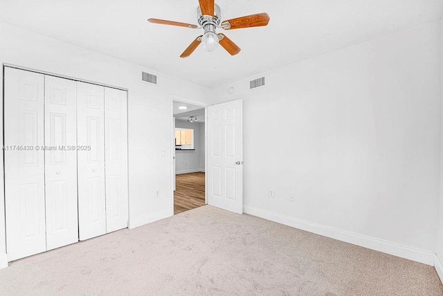 3505 Briar Bay Blvd Unit 104, West Palm Beach, FL 33411 - unfurnished bedroom featuring carpet, baseboards, a closet, and ceiling fan