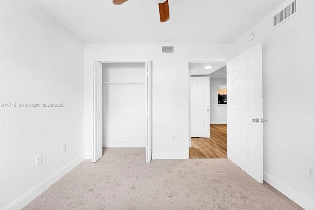 3505 Briar Bay Blvd Unit 104, West Palm Beach, FL 33411 - unfurnished bedroom featuring carpet flooring, baseboards, a closet, and ceiling fan