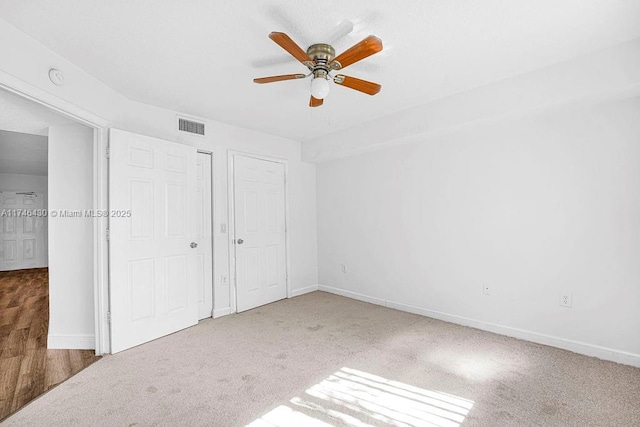 3505 Briar Bay Blvd Unit 104, West Palm Beach, FL 33411 - unfurnished bedroom featuring carpet floors, baseboards, and a closet