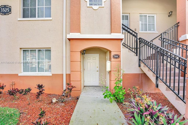 3505 Briar Bay Blvd Unit 104, West Palm Beach, FL 33411 - entrance to property with stucco siding