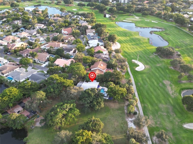 birds eye view of property with a water view, a residential view, and golf course view