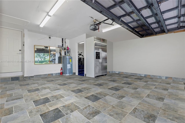 garage featuring water heater, built in fridge, and a garage door opener