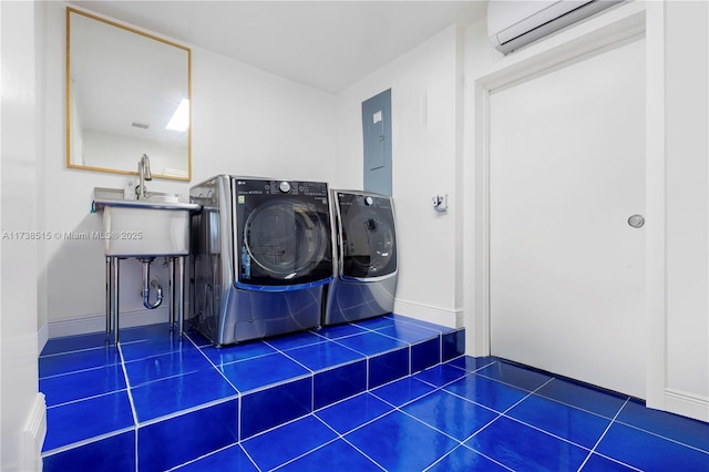 washroom with laundry area, separate washer and dryer, tile patterned floors, a wall mounted AC, and electric panel