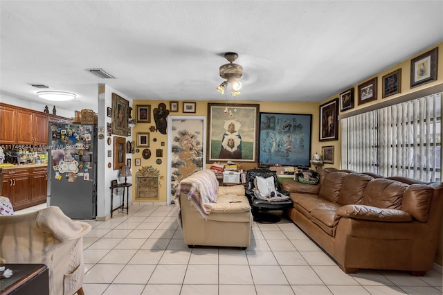 living room with light tile patterned floors