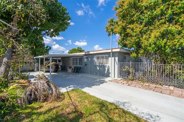 exterior space with a carport