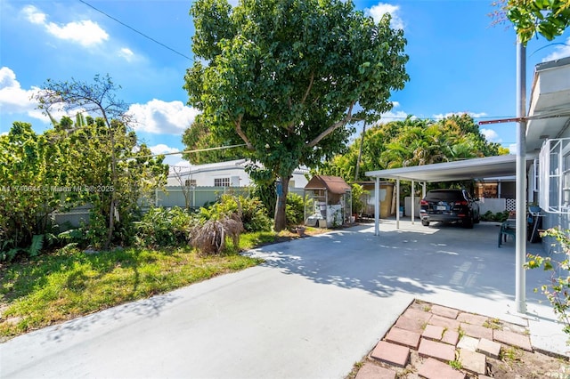 exterior space with a carport