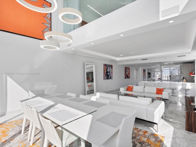 dining area featuring a tray ceiling