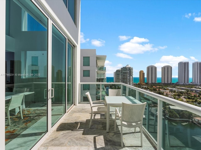 balcony featuring a water view