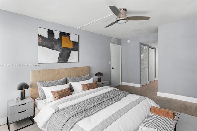 bedroom with hardwood / wood-style flooring and ceiling fan