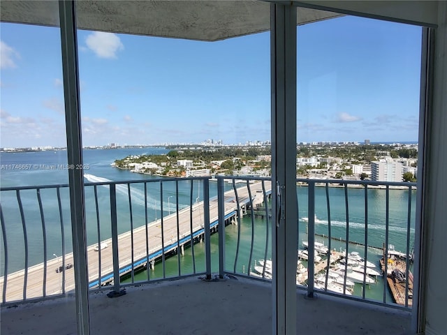 balcony featuring a water view