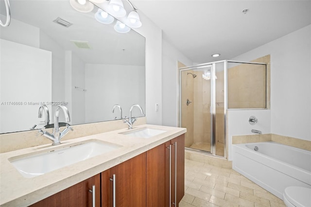 bathroom featuring a sink, visible vents, and a shower stall