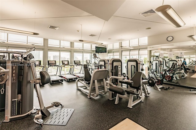 workout area with visible vents and a healthy amount of sunlight