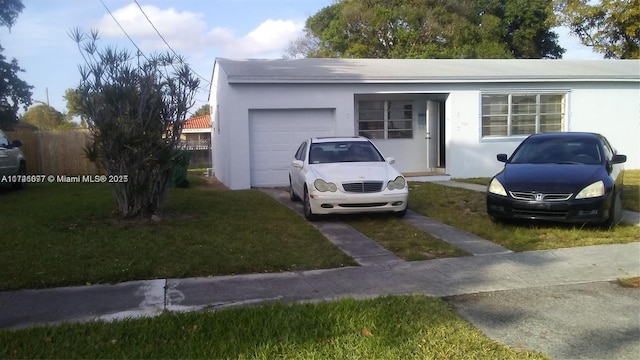 view of front of home with a garage and a front yard