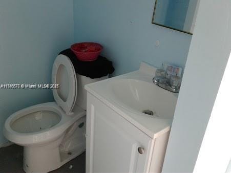 bathroom featuring vanity and toilet