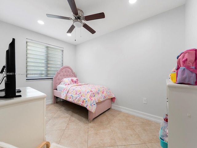 tiled bedroom featuring ceiling fan