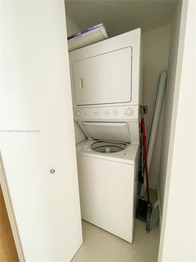 laundry area with stacked washing maching and dryer