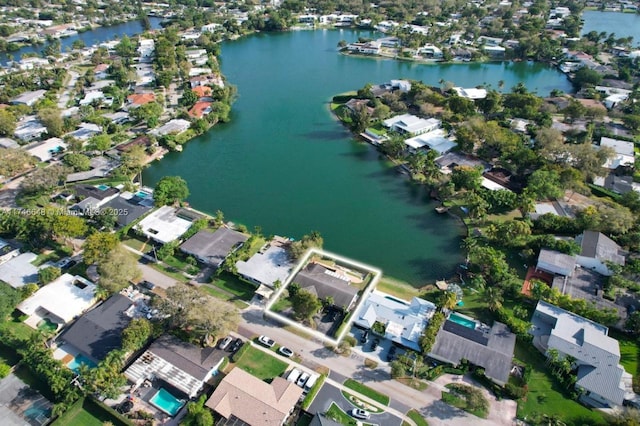 drone / aerial view featuring a water view and a residential view