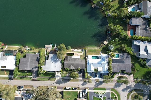 bird's eye view featuring a water view and a residential view