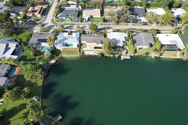 bird's eye view featuring a residential view and a water view