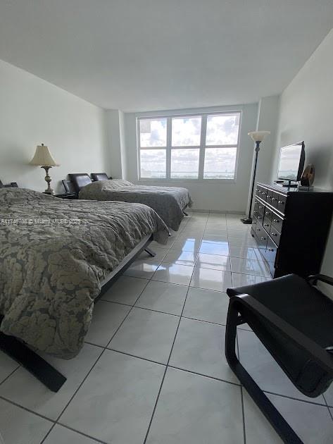 bedroom with light tile patterned floors