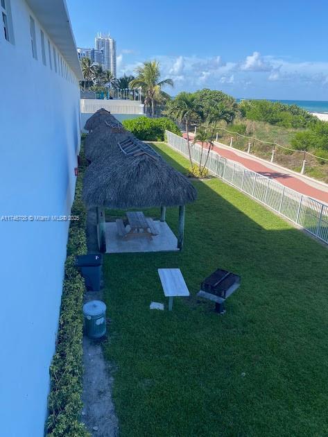 view of yard featuring a gazebo, a water view, and a patio