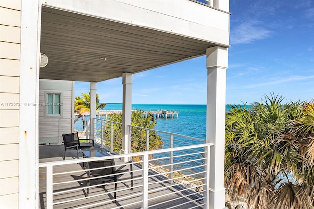 balcony featuring a water view