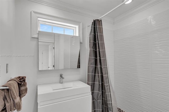 bathroom featuring vanity, ornamental molding, and a shower with shower curtain