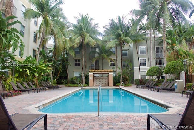 view of swimming pool with a patio area