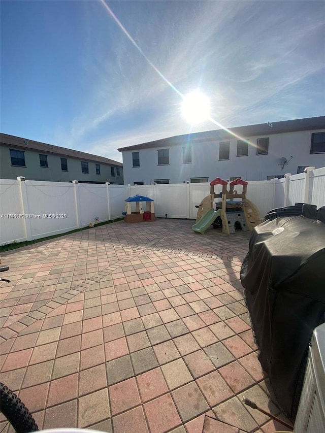 view of patio with a playground