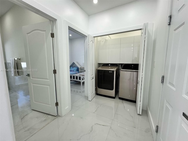 laundry room with independent washer and dryer