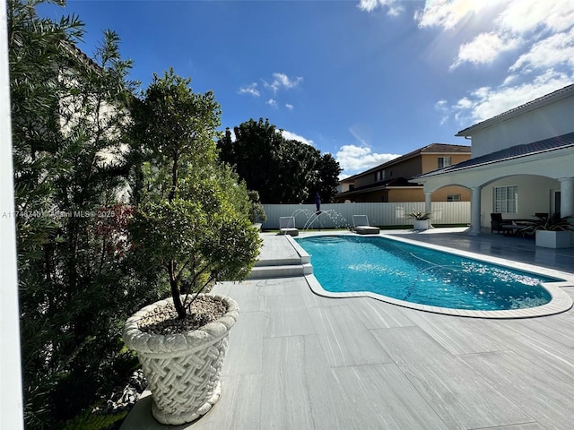 view of swimming pool featuring a patio