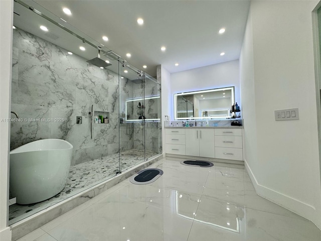 bathroom featuring vanity and separate shower and tub