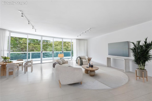 living room with expansive windows and track lighting