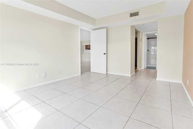 unfurnished bedroom featuring visible vents, baseboards, and light tile patterned flooring